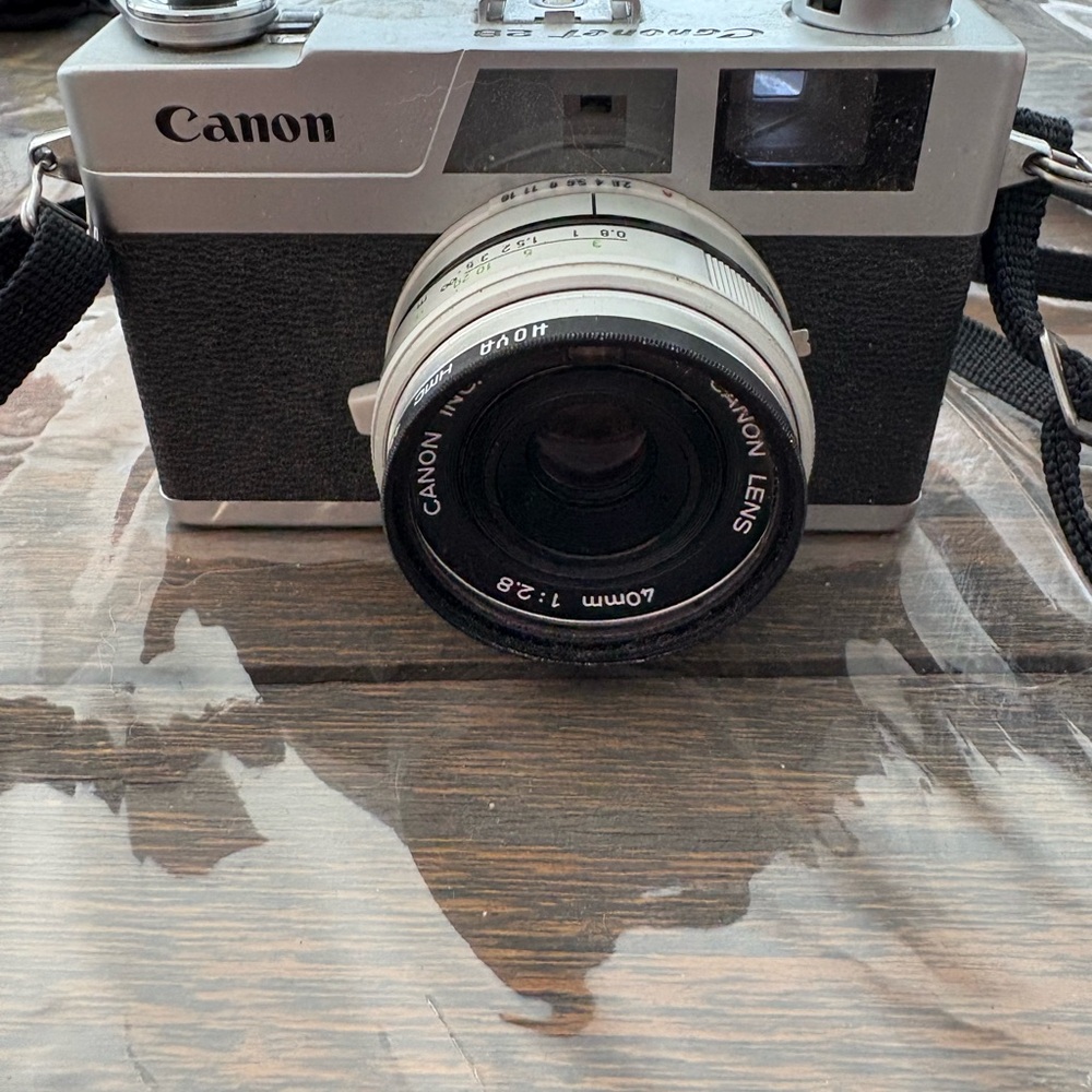 Canon Black and Silver Camera with Strap - Picture 4 of 4